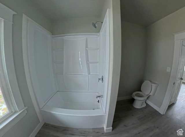 197 W Center St, Midvale, UT 84047 - bathroom with toilet, baseboards, wood finished floors, and shower / bathtub combination