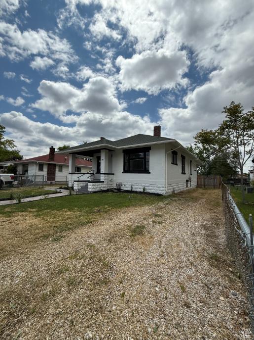 197 W Center St, Midvale, UT 84047 - view of front of house with a chimney