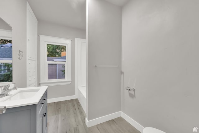 197 W Center St, Midvale, UT 84047 - full bathroom featuring wood finished floors and vanity