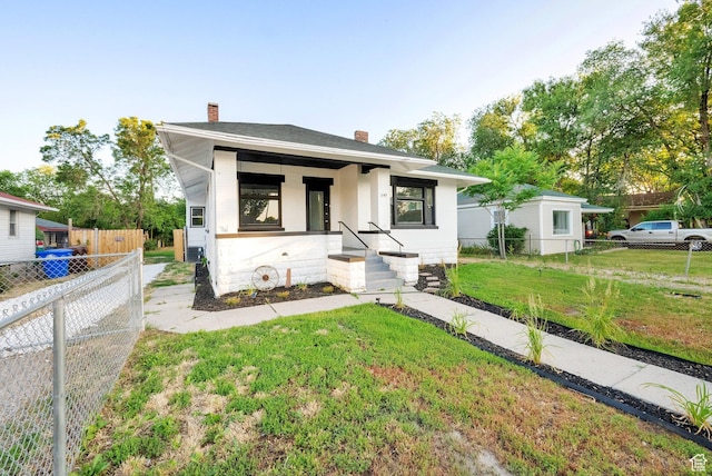197 W Center St, Midvale, UT 84047 - view of front of home with a chimney and a porch