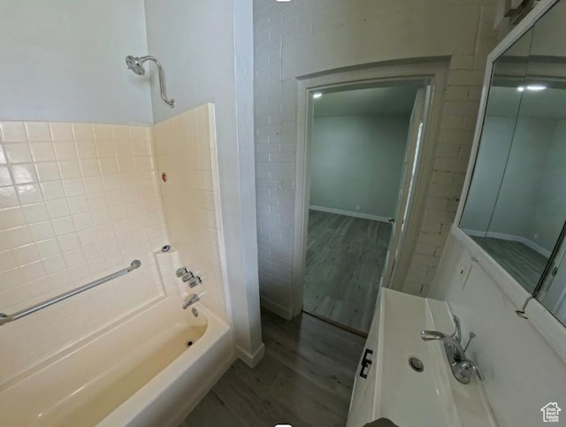 197 W Center St, Midvale, UT 84047 - full bath with wood finished floors and shower / bathtub combination