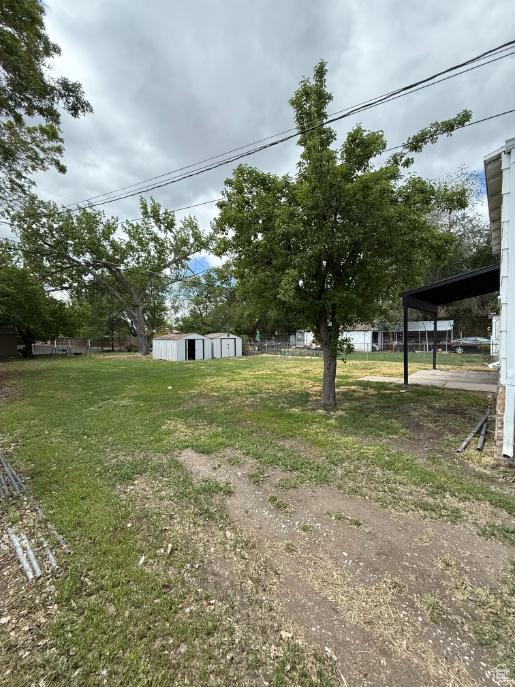 197 W Center St, Midvale, UT 84047 - view of yard featuring an outbuilding