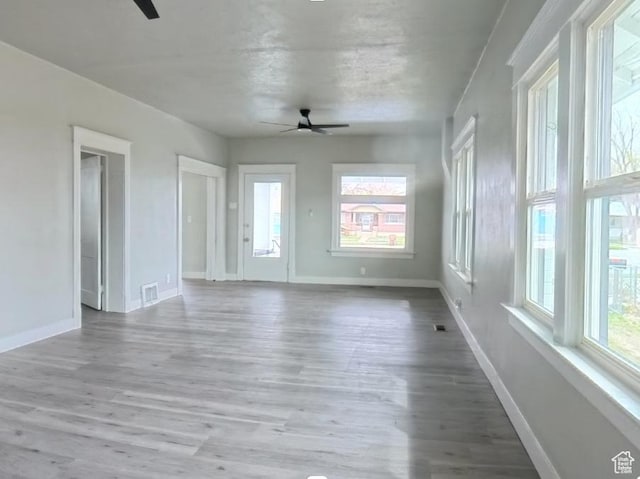 197 W Center St, Midvale, UT 84047 - empty room featuring ceiling fan, wood finished floors, and baseboards