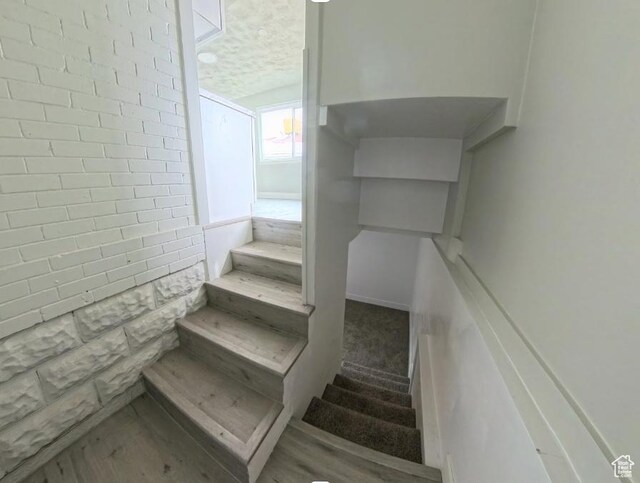 197 W Center St, Midvale, UT 84047 - staircase featuring a textured ceiling