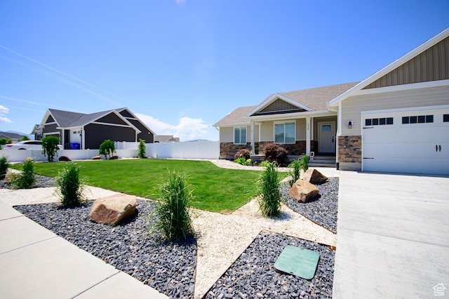534 S Chan Dr, Grantsville, UT 84029 - view of front of home with board and batten siding, a garage, concrete driveway, and stone siding