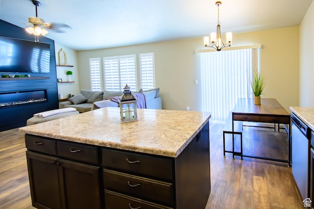 534 S Chan Dr, Grantsville, UT 84029 - kitchen featuring wood finished floors, a chandelier, dishwasher, hanging light fixtures, and dark brown cabinets