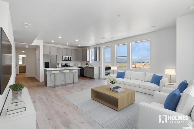 5263 W Reventon Rd S, South Jordan, UT 84009 - living room featuring recessed lighting, light wood-style floors, and baseboards
