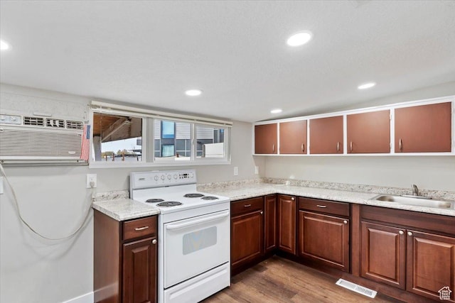 272 S State St, Clearfield, UT 84015 - kitchen featuring white electric range, a sink, dark wood-style floors, light countertops, and recessed lighting