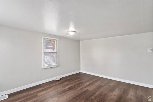 272 S State St, Clearfield, UT 84015 - spare room featuring baseboards and dark wood-style flooring