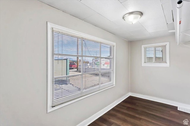 272 S State St, Clearfield, UT 84015 - spare room featuring baseboards and dark wood-style floors