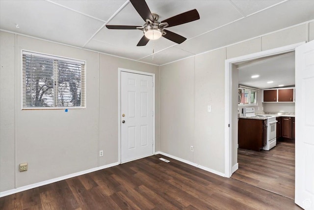 272 S State St, Clearfield, UT 84015 - spare room featuring a ceiling fan, dark wood-style floors, and baseboards