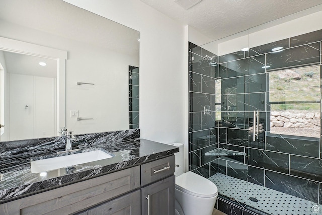 1189 E Benchview Dr, Ogden, UT 84404 - bathroom featuring a stall shower, vanity, and toilet