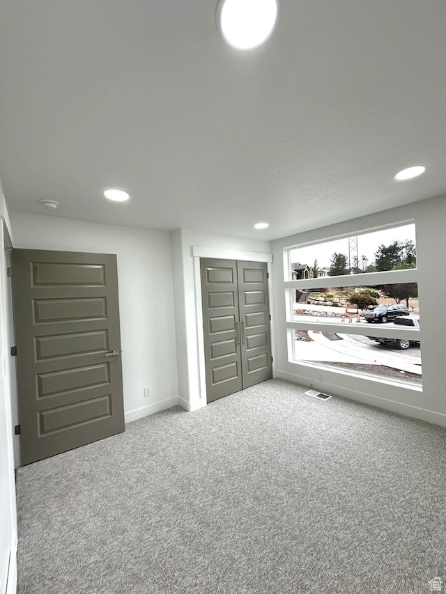 1189 E Benchview Dr, Ogden, UT 84404 - unfurnished bedroom featuring carpet floors, recessed lighting, baseboards, and a closet