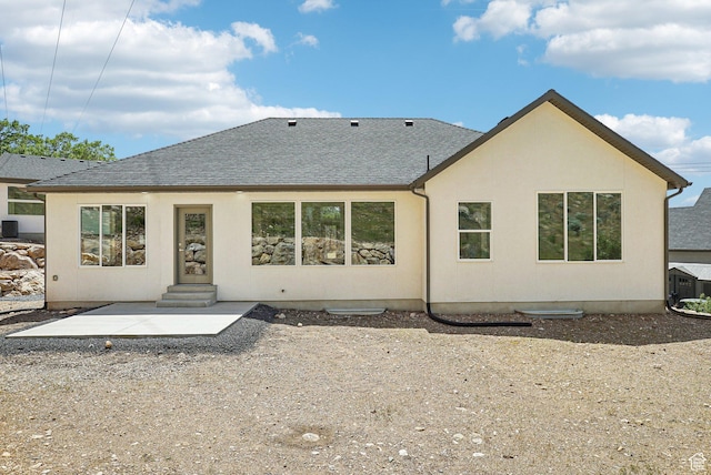 1189 E Benchview Dr, Ogden, UT 84404 - back of property with roof with shingles, a patio area, entry steps, stucco siding, and central AC unit