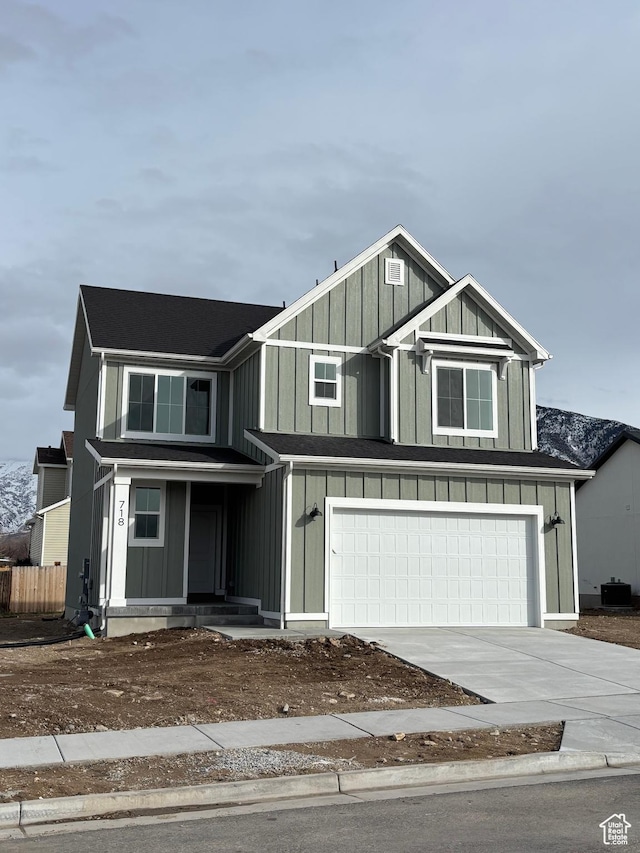718 N 280 E, Tooele, UT 84074 - view of front of house featuring a garage, driveway, and board and batten siding