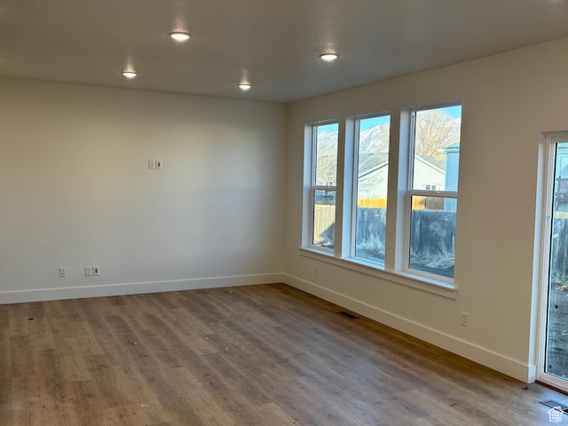 718 N 280 E, Tooele, UT 84074 - unfurnished room with baseboards, wood finished floors, and recessed lighting