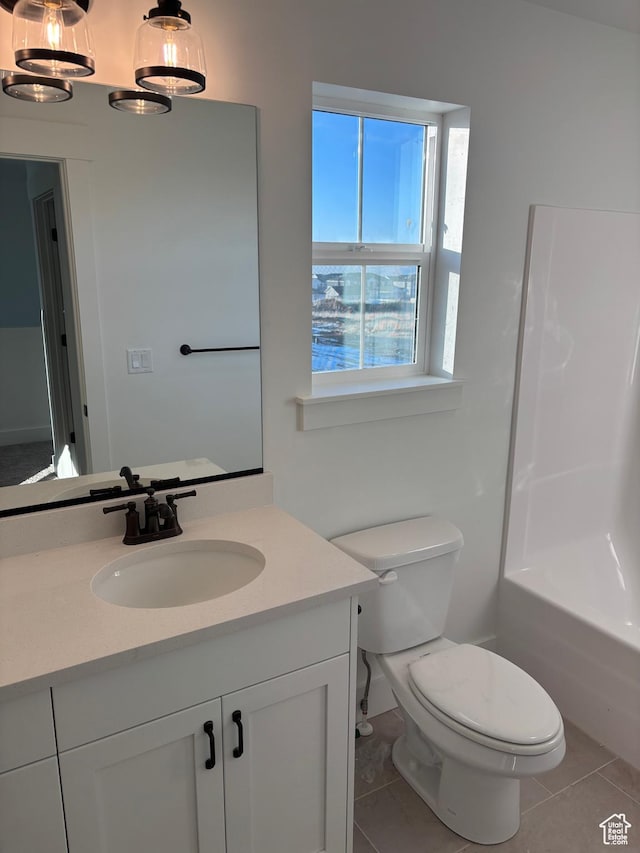 718 N 280 E, Tooele, UT 84074 - bathroom featuring vanity, toilet, and tile patterned flooring
