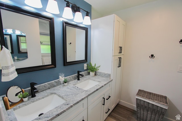 1460 E 2100 N, North Logan, UT 84341 - full bathroom featuring double vanity, wood finished floors, and baseboards