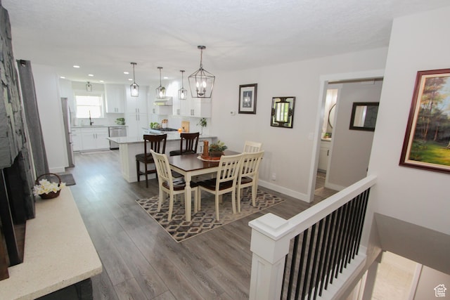 1460 E 2100 N, North Logan, UT 84341 - dining space with recessed lighting, wood finished floors, baseboards, a fireplace, and a chandelier