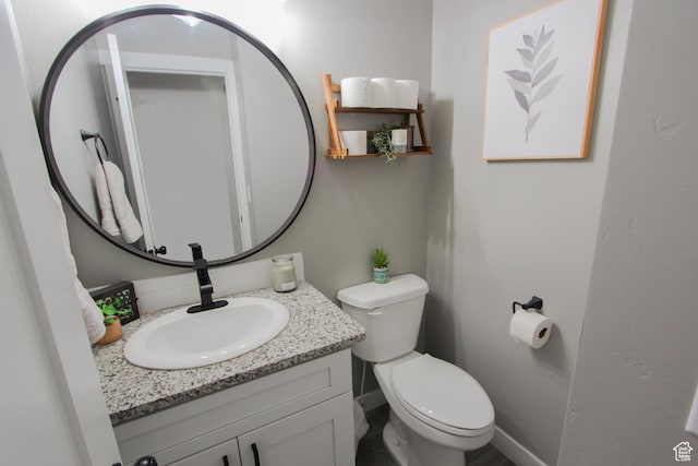 1460 E 2100 N, North Logan, UT 84341 - half bath featuring vanity, toilet, decorative backsplash, and baseboards