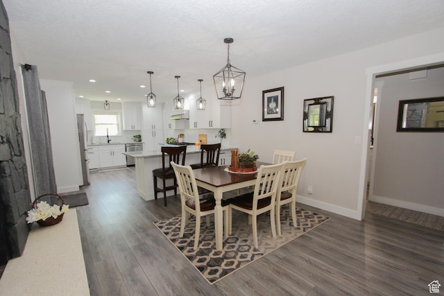 1460 E 2100 N, North Logan, UT 84341 - dining room featuring dark wood-type flooring, recessed lighting, baseboards, and a chandelier