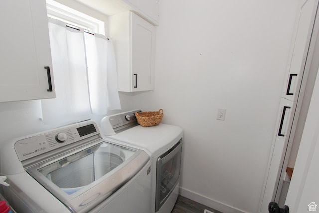1460 E 2100 N, North Logan, UT 84341 - laundry room with cabinet space, washing machine and dryer, baseboards, and wood finished floors