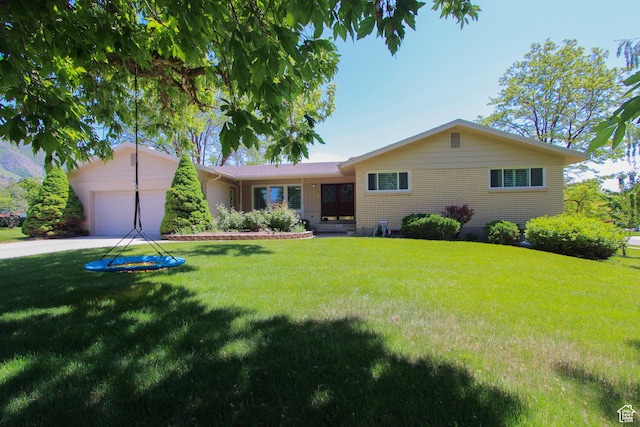 1460 E 2100 N, North Logan, UT 84341 - single story home with a garage, a front lawn, brick siding, and concrete driveway