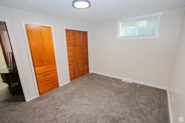 1460 E 2100 N, North Logan, UT 84341 - unfurnished bedroom featuring carpet floors, a closet, and baseboards