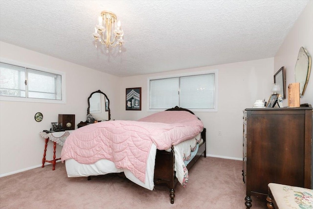 310 E Valley View Dr, Preston, ID 83263 - bedroom with carpet, a textured ceiling, a chandelier, and baseboards