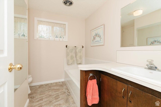 310 E Valley View Dr, Preston, ID 83263 - full bath with vanity, toilet, a tub, and baseboards