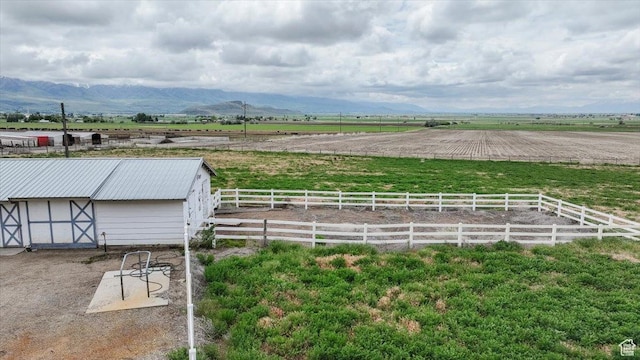 310 E Valley View Dr, Preston, ID 83263 - view of yard featuring a view of countryside, an outdoor structure, a mountain view, and an exterior structure