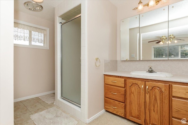 310 E Valley View Dr, Preston, ID 83263 - bathroom featuring a stall shower, vanity, and baseboards