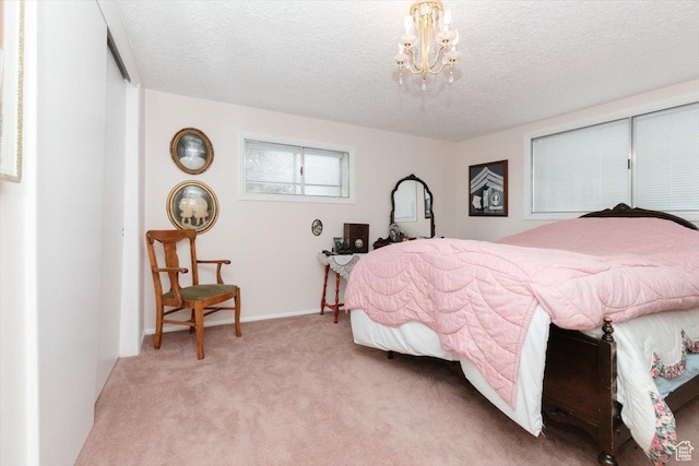 310 E Valley View Dr, Preston, ID 83263 - bedroom with light colored carpet, a chandelier, and a textured ceiling