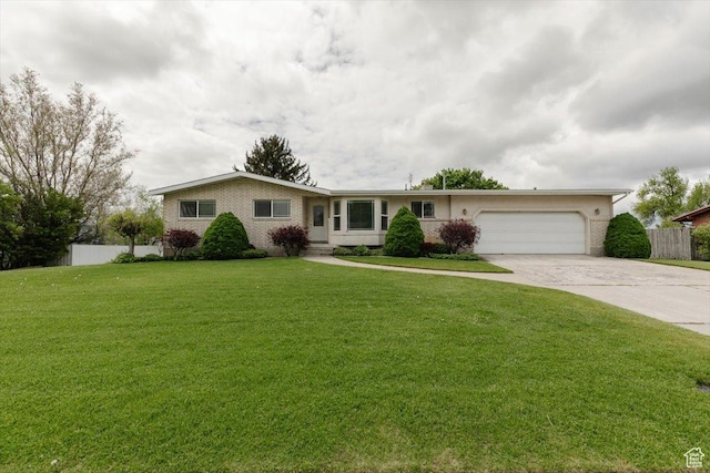 310 E Valley View Dr, Preston, ID 83263 - ranch-style house with driveway, a garage, and brick siding