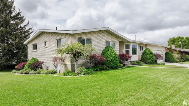 310 E Valley View Dr, Preston, ID 83263 - view of front facade with an attached garage, a front lawn, and concrete driveway