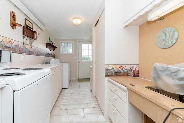 310 E Valley View Dr, Preston, ID 83263 - laundry area with light tile patterned flooring and a textured ceiling