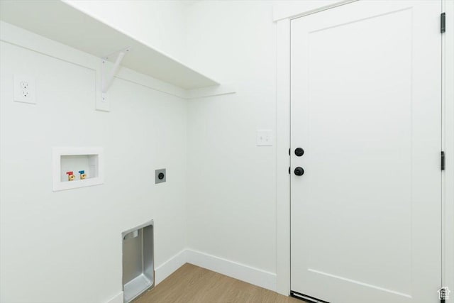821 E 160 N, Hyde Park, UT 84318 - washroom with hookup for an electric dryer, hookup for a washing machine, light wood finished floors, and baseboards