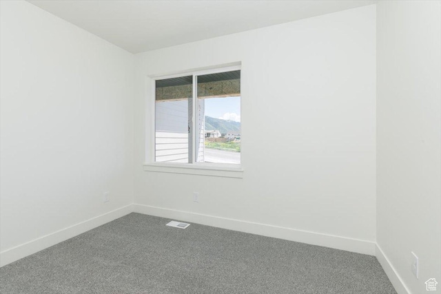 821 E 160 N, Hyde Park, UT 84318 - unfurnished room featuring dark colored carpet and baseboards