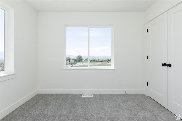 821 E 160 N, Hyde Park, UT 84318 - unfurnished bedroom with carpet floors, multiple windows, and baseboards