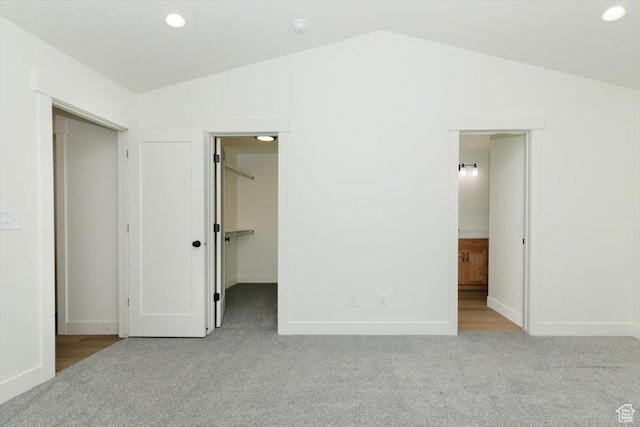 821 E 160 N, Hyde Park, UT 84318 - unfurnished bedroom with carpet, lofted ceiling, a spacious closet, and baseboards