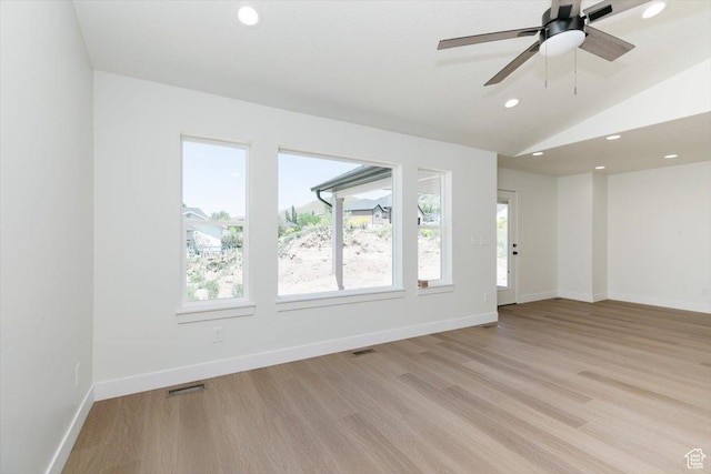 821 E 160 N, Hyde Park, UT 84318 - empty room featuring plenty of natural light, light wood-type flooring, recessed lighting, vaulted ceiling, and baseboards