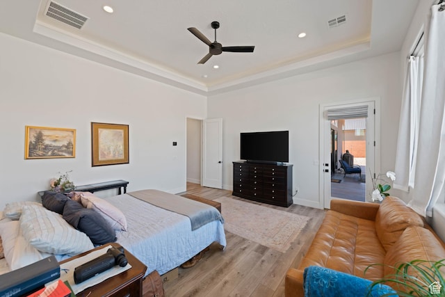 108 N Arrowhead Ln, Ivins, UT 84738 - bedroom featuring a raised ceiling, light wood-style floors, a ceiling fan, baseboards, and recessed lighting