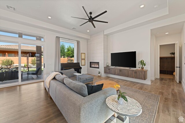 108 N Arrowhead Ln, Ivins, UT 84738 - living room featuring a ceiling fan, wood finished floors, a fireplace, recessed lighting, and baseboards