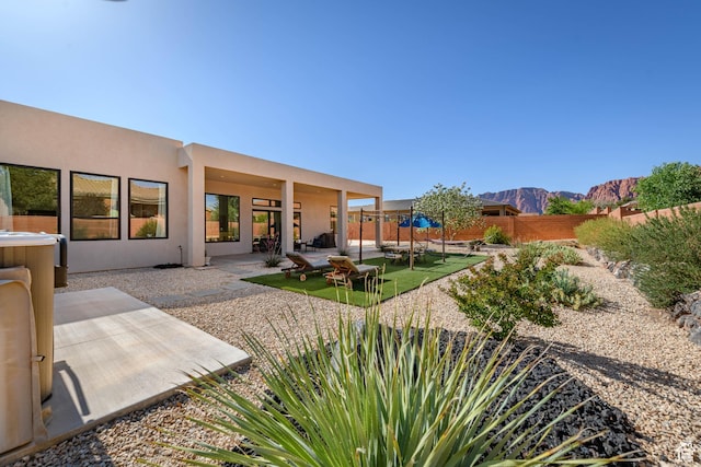108 N Arrowhead Ln, Ivins, UT 84738 - fenced backyard featuring a patio area and a mountain view