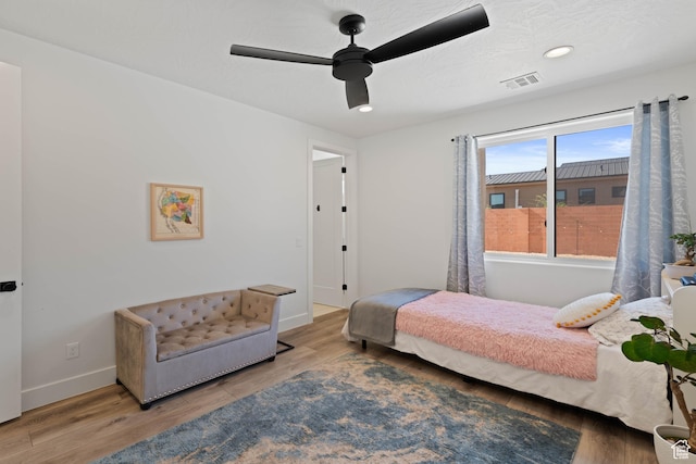 108 N Arrowhead Ln, Ivins, UT 84738 - bedroom with baseboards, wood finished floors, a ceiling fan, and recessed lighting