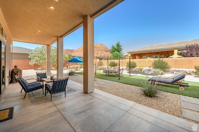 108 N Arrowhead Ln, Ivins, UT 84738 - fenced backyard with a patio and a mountain view