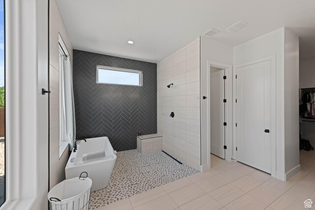 108 N Arrowhead Ln, Ivins, UT 84738 - full bath featuring walk in shower, a freestanding tub, a closet, and tile patterned flooring