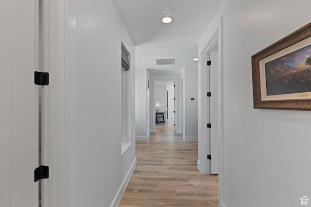 108 N Arrowhead Ln, Ivins, UT 84738 - corridor with light wood-type flooring and baseboards