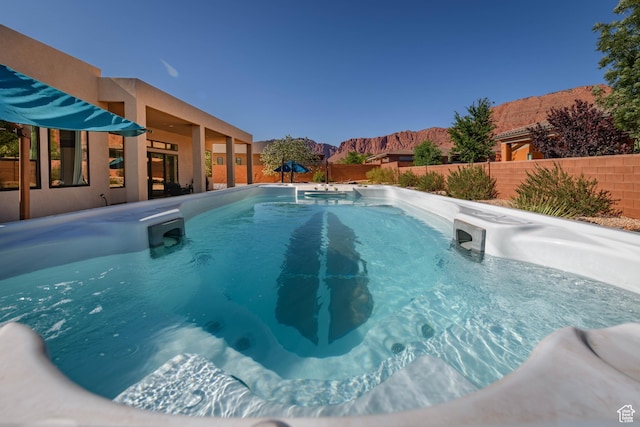 108 N Arrowhead Ln, Ivins, UT 84738 - view of pool featuring a fenced backyard, a swimming pool, and a mountain view