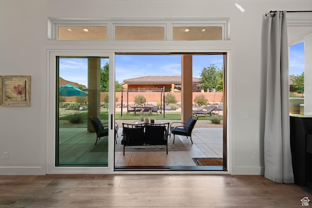 108 N Arrowhead Ln, Ivins, UT 84738 - doorway to outside featuring baseboards and wood finished floors